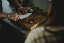 Fiskars Norden Large Cook's Knife -Kitchenware Shop Fiskars Norden Large cooks knife chopping carrots 1026419