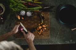 Fiskars Norden Paring Knife -Kitchenware Shop Fiskars Norden Paring knife cutting onion Hero image 1026424